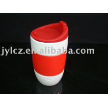 Ceramic mug with silicone band and lid